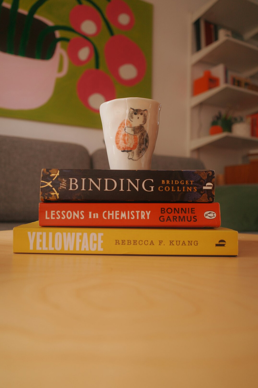 Table with books, notebooks and cups prepared for a reading club